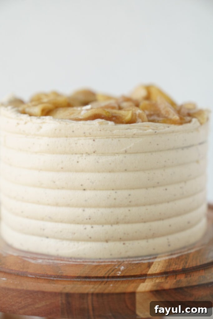 Stacked mini apple cakes with frosting and apple filling
