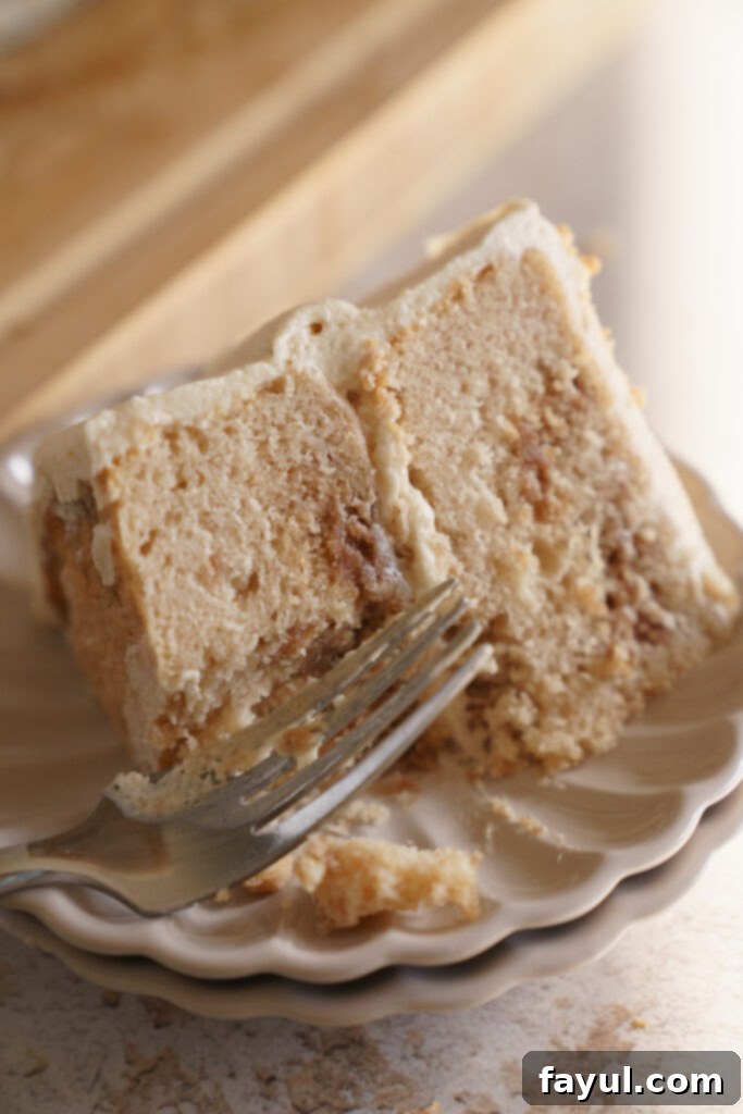 Close-up of a slice of Mini Snickerdoodle Cake showing the cinnamon swirl