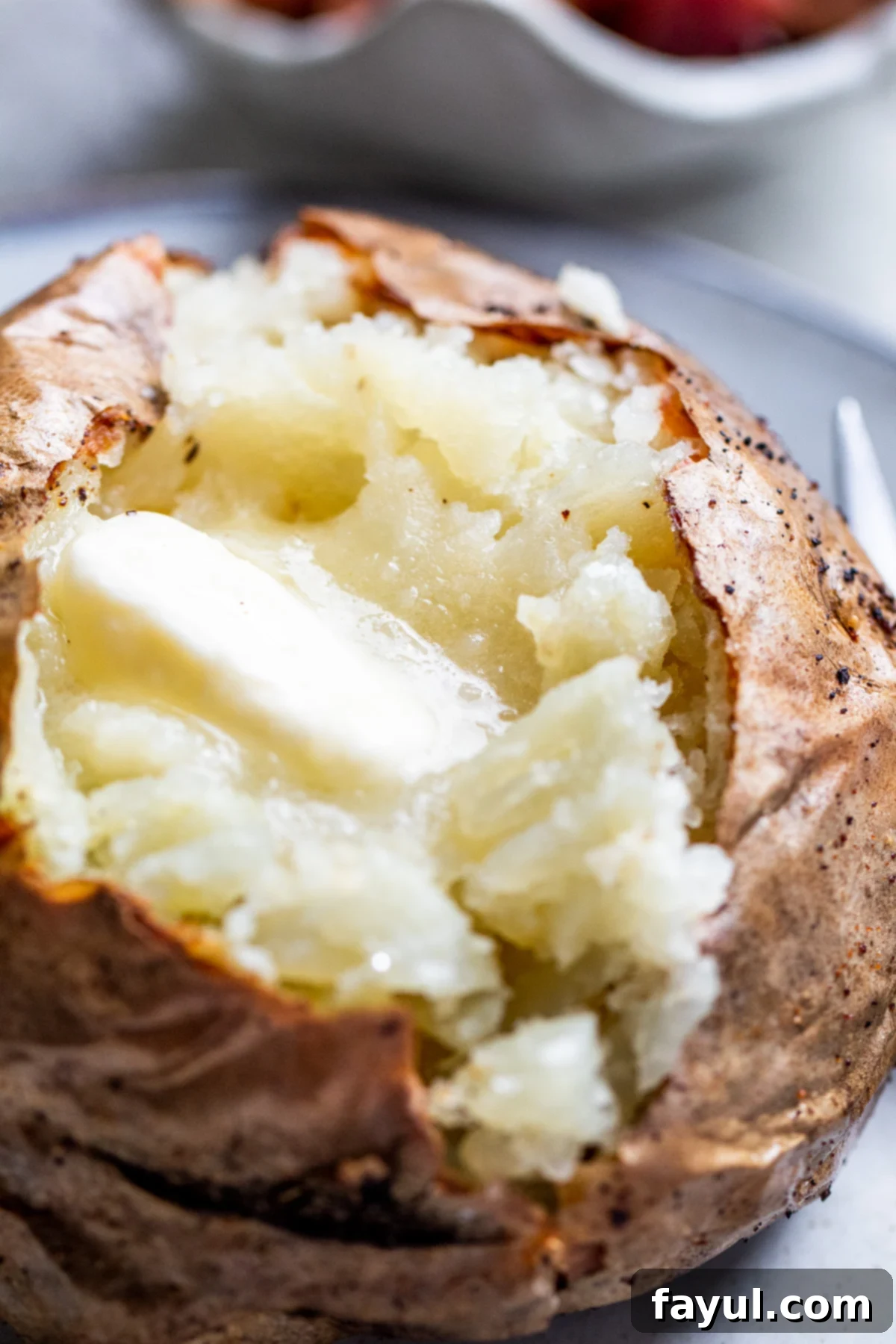 Potato cut with butter on it.