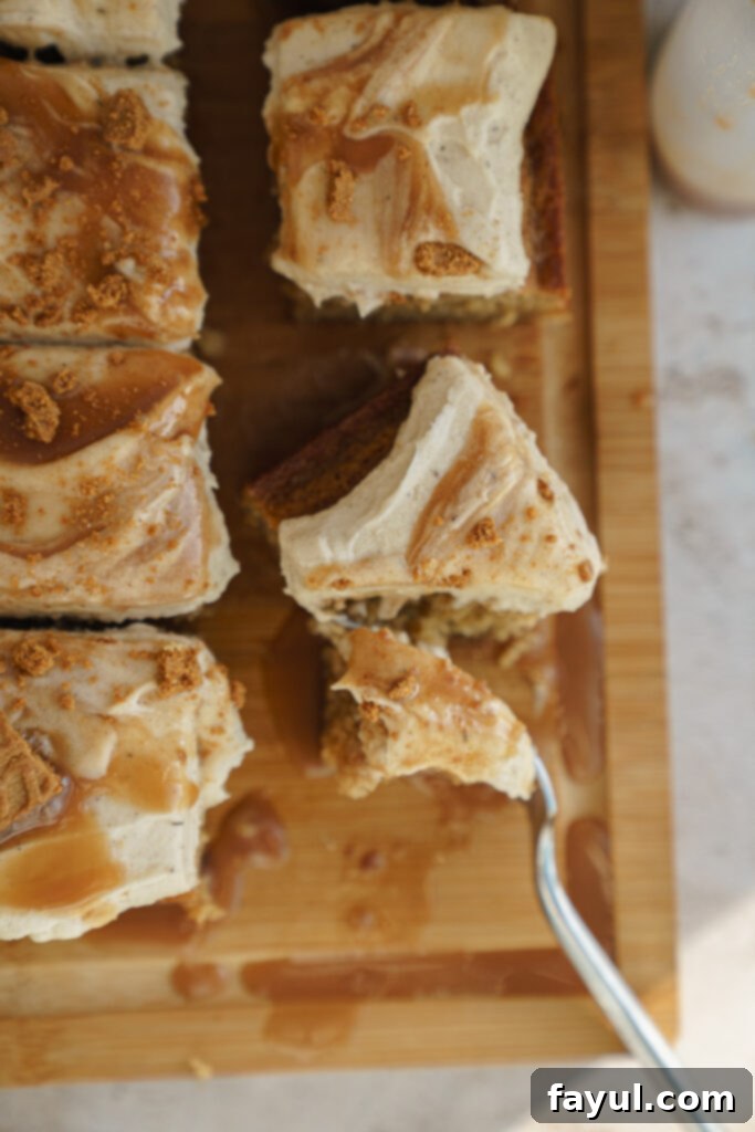 Slice of Caramel Biscoff Cake revealing moist layers and creamy frosting