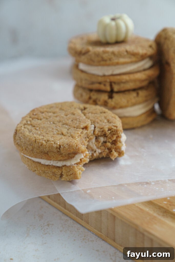 Close-up of a pumpkin cookie sandwich on a plate