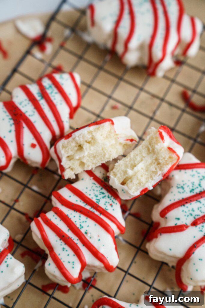 Close-up of a homemade Little Debbie Christmas Tree Cake showing the fluffy cake and marshmallow filling