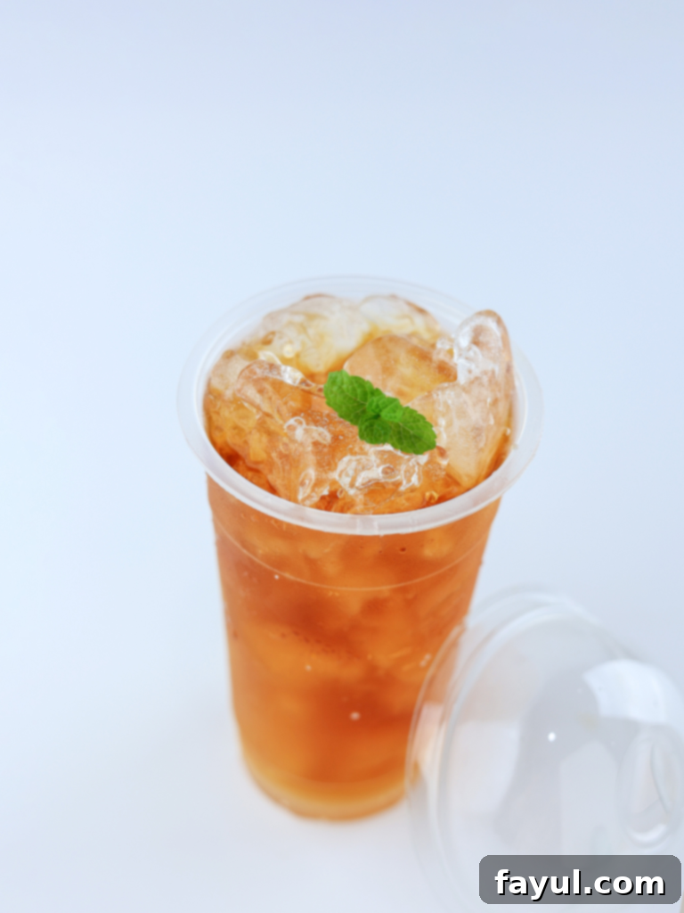 A hot cup of Jade Citrus Mint Tea, with steam rising from the mug.