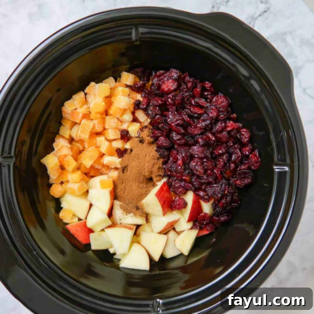Overhead shot of all ingredients layered in the crock pot.