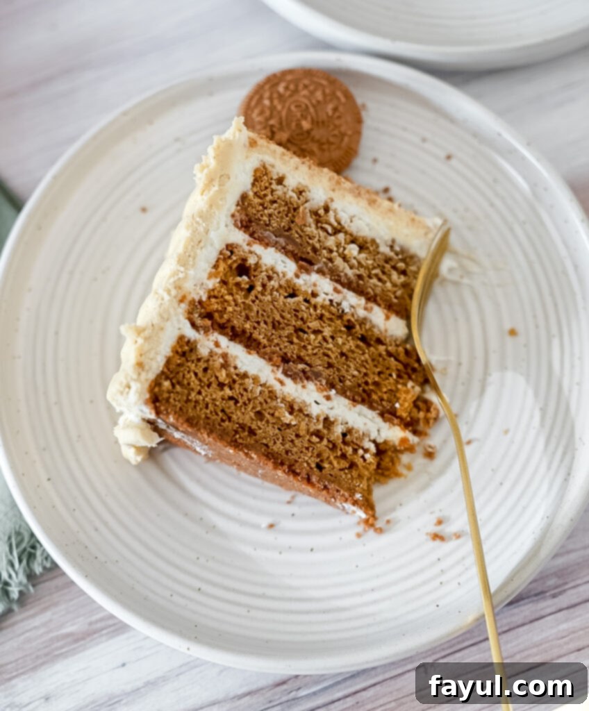 Close-up shot of the multi-layered Oreo Gingerbread Cake showing the distinct gingerbread cake, cream cheese filling, and gingerbread buttercream.