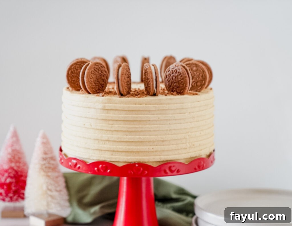 Close-up of crushed gingerbread Oreo cookies mixed with butter and sugar, forming the cake crust.