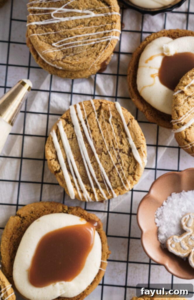 Two Gingerbread Caramel Cookie Sandwiches, one drizzled with white chocolate.