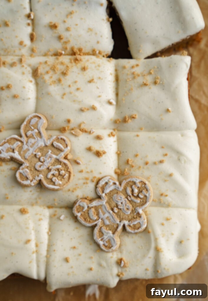 Two gingerbread cinnamon roll blondies on a plate