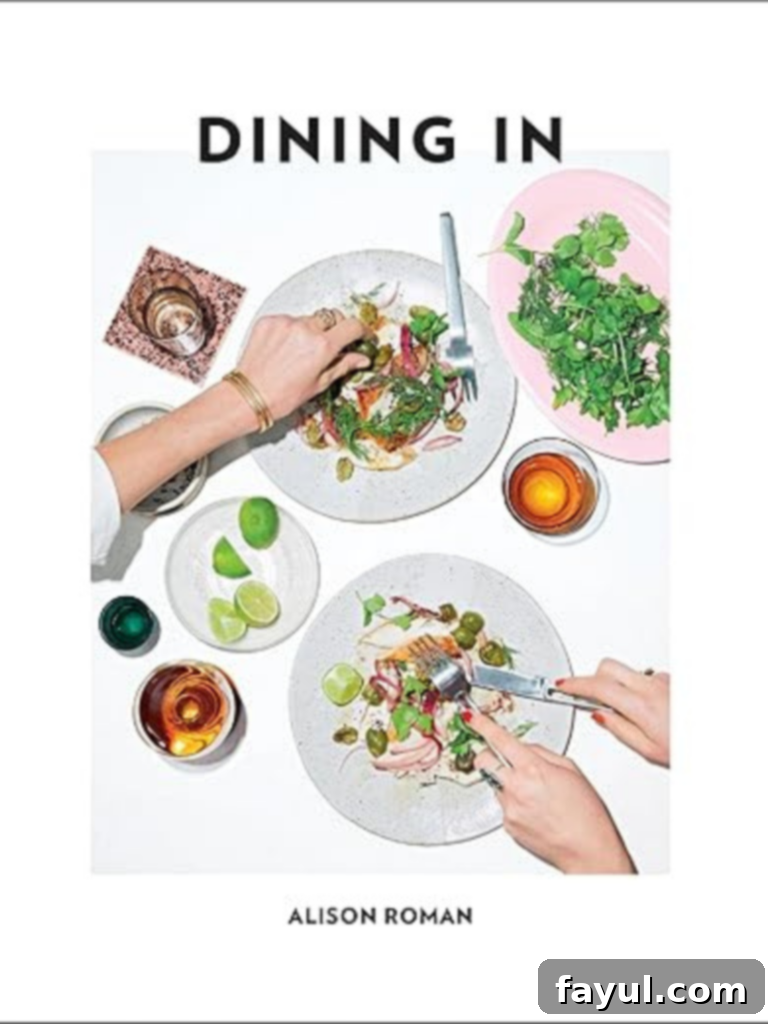 A selection of recommended cookbooks neatly stacked
