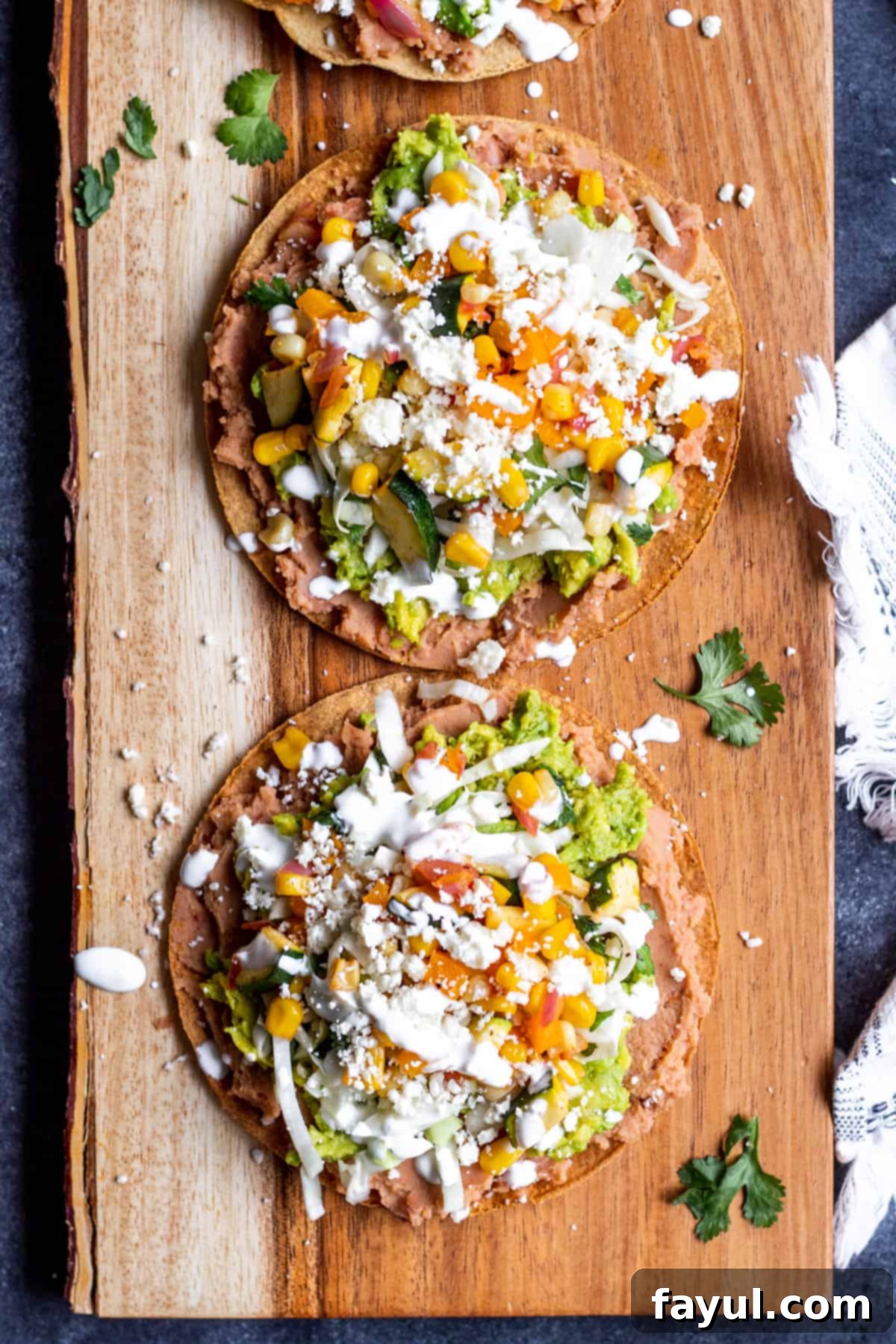 Crispy Vegetarian Tostadas with Bright Cilantro Lime Slaw 2 Overhead shot of tostadas on wooden serving platter.