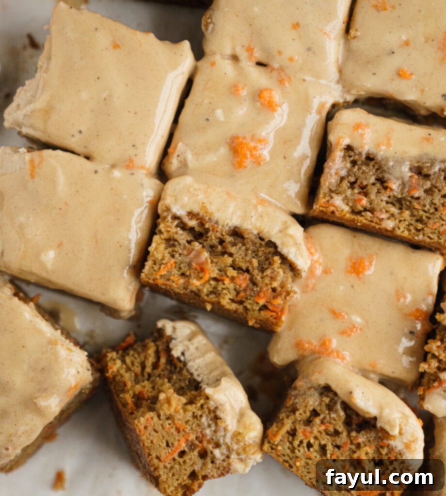 Overhead view of Caramel Carrot Cake with Chai Spiced Frosting, topped with cinnamon sticks