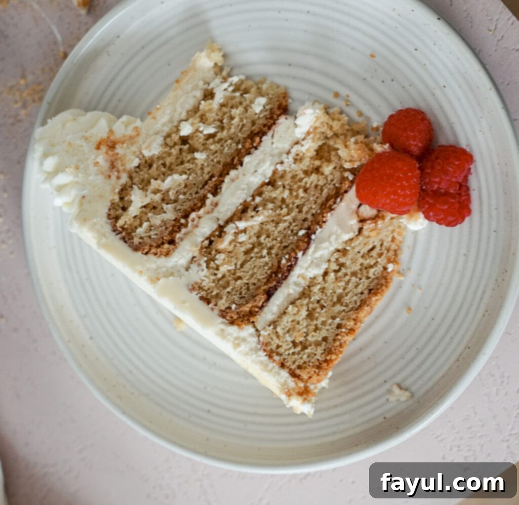 Close-up of a slice of the ultimate birthday cake, showing the perfect layers and rich textures.