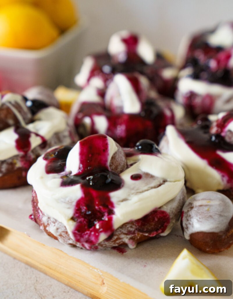 stack of fried blueberry ricotta donuts with creme fraiche and compote