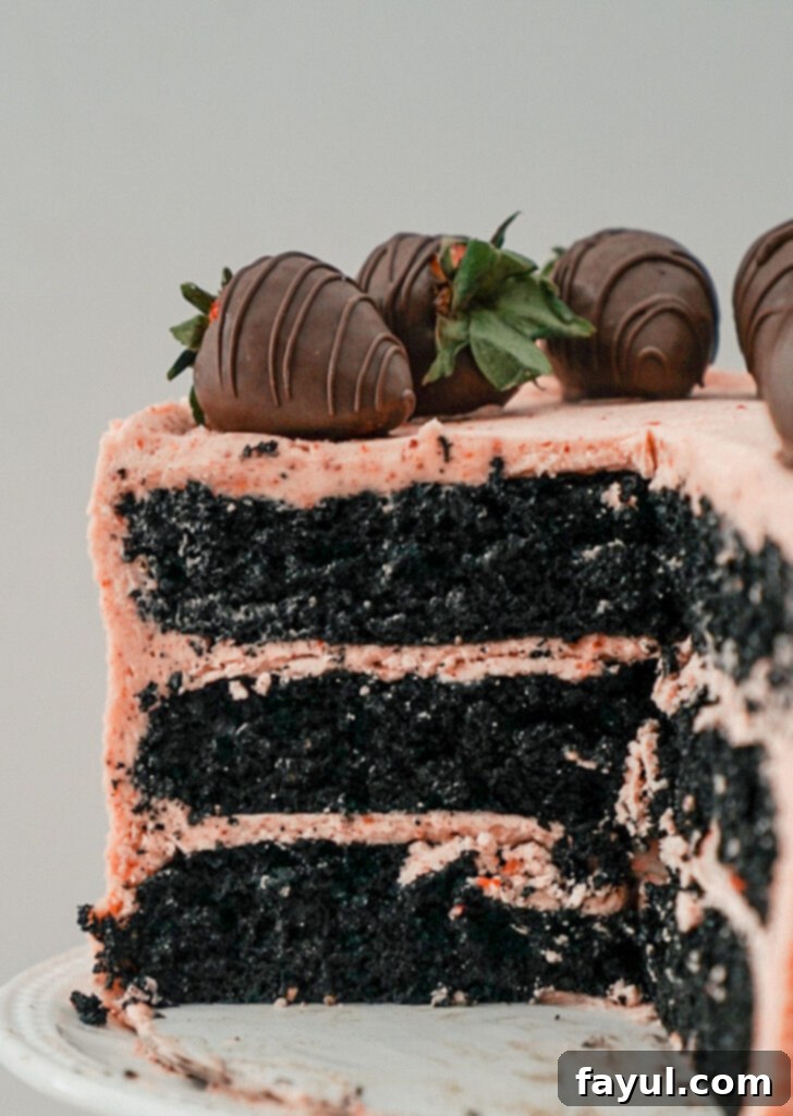 Close-up of a vibrant and creamy homemade strawberry buttercream, showing its smooth texture and natural pink color.