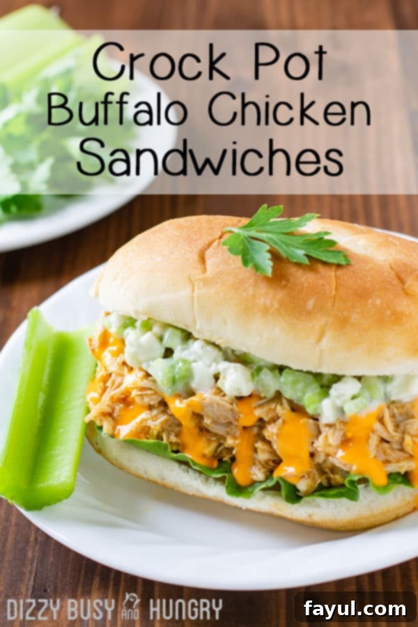 Side view of buffalo chicken sandwich with a side of celery on a white plate and wooden background.