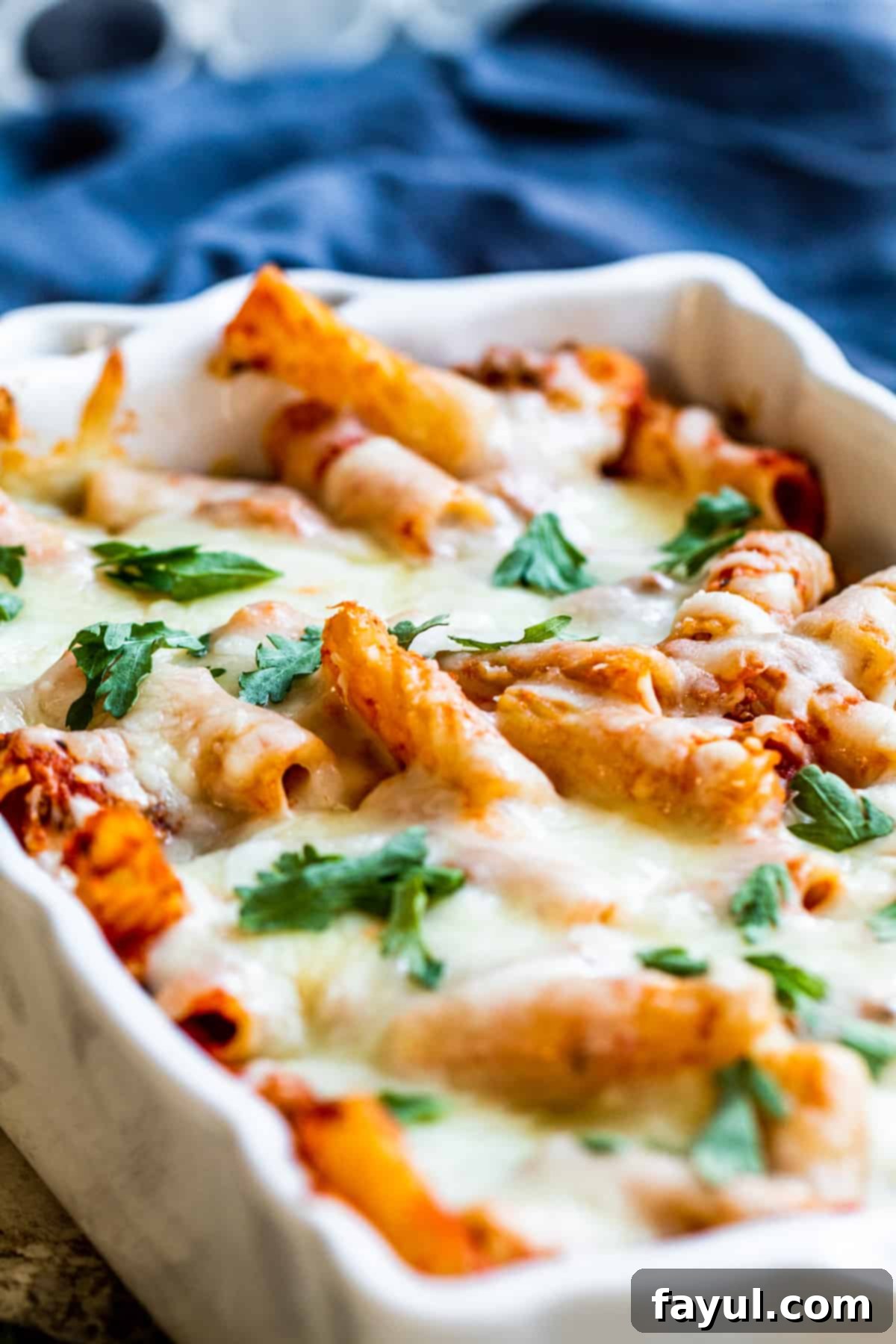 Mostaccioli in a white baking dish.