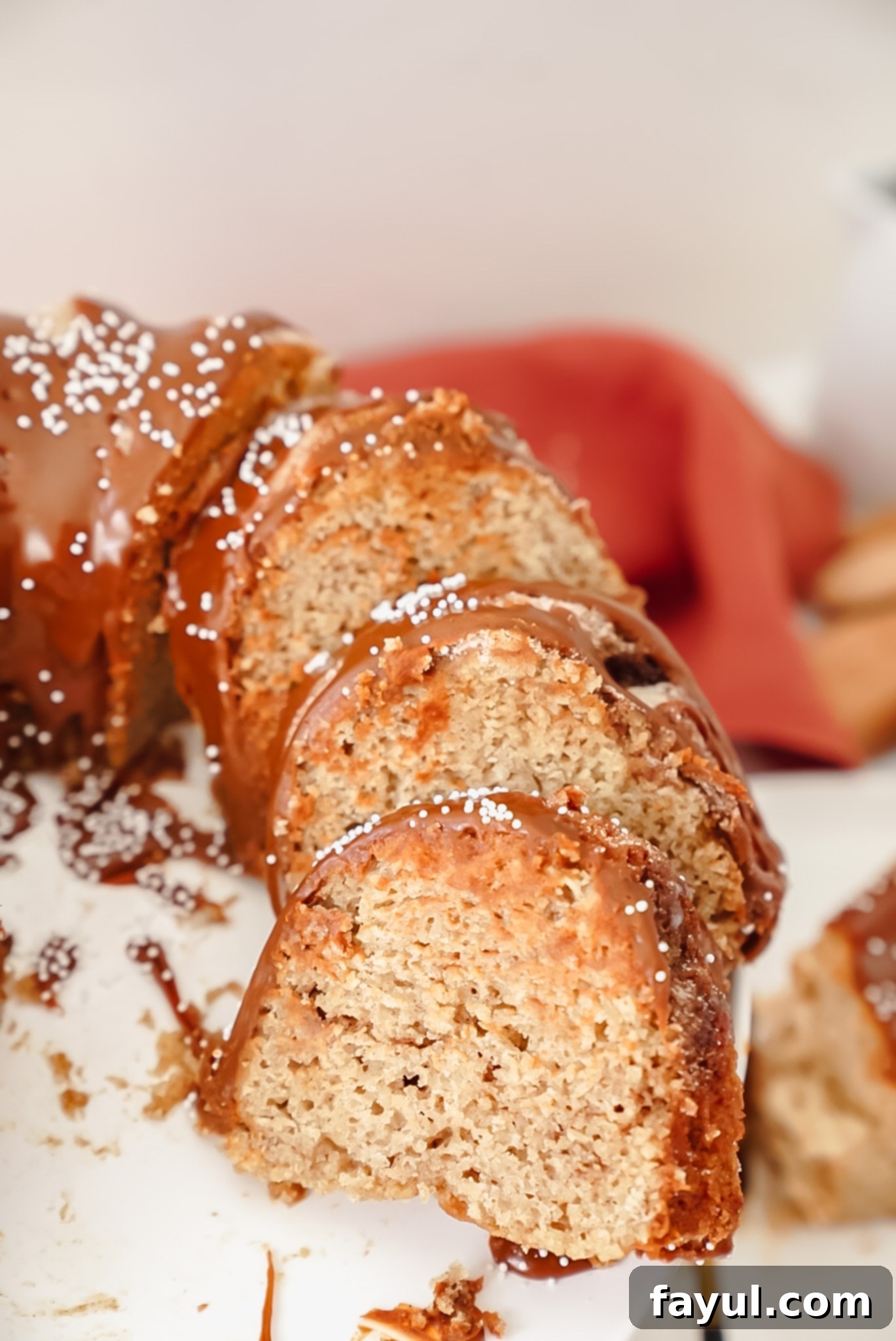 An overhead shot of the whole churro bundt cake, beautifully glazed with a cinnamon ganache, ready to be served.