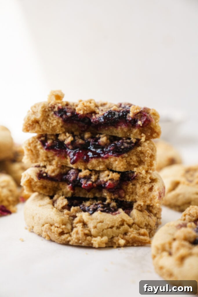 Stacked browned butter blueberry cookies, with one showing the side profile