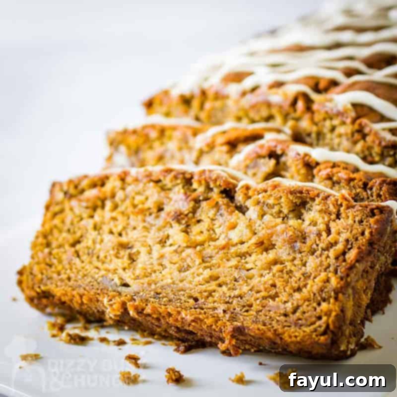Close up view of slices of banana bread on a white rectangle plate.