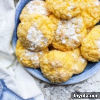 Blue plate filled with cake cookies on a white counter.