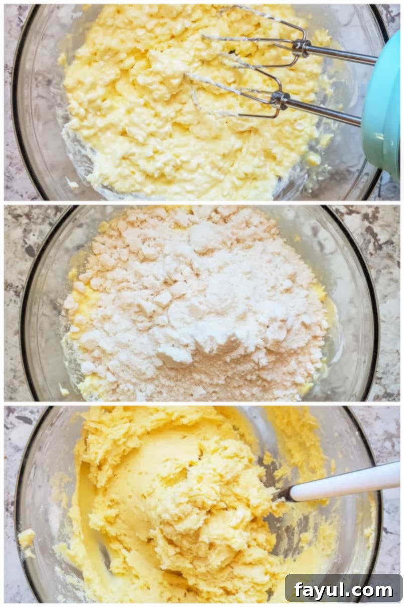 A close-up shot of gooey butter cookie dough being mixed in a clear glass bowl, showcasing its thick and slightly sticky texture as it comes together.