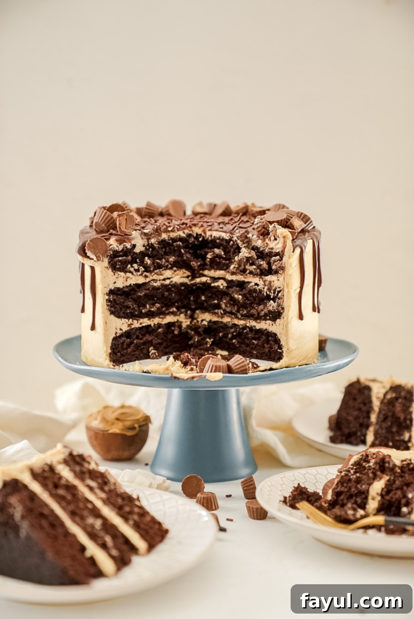 Close-up of creamy peanut butter buttercream between chocolate cake layers
