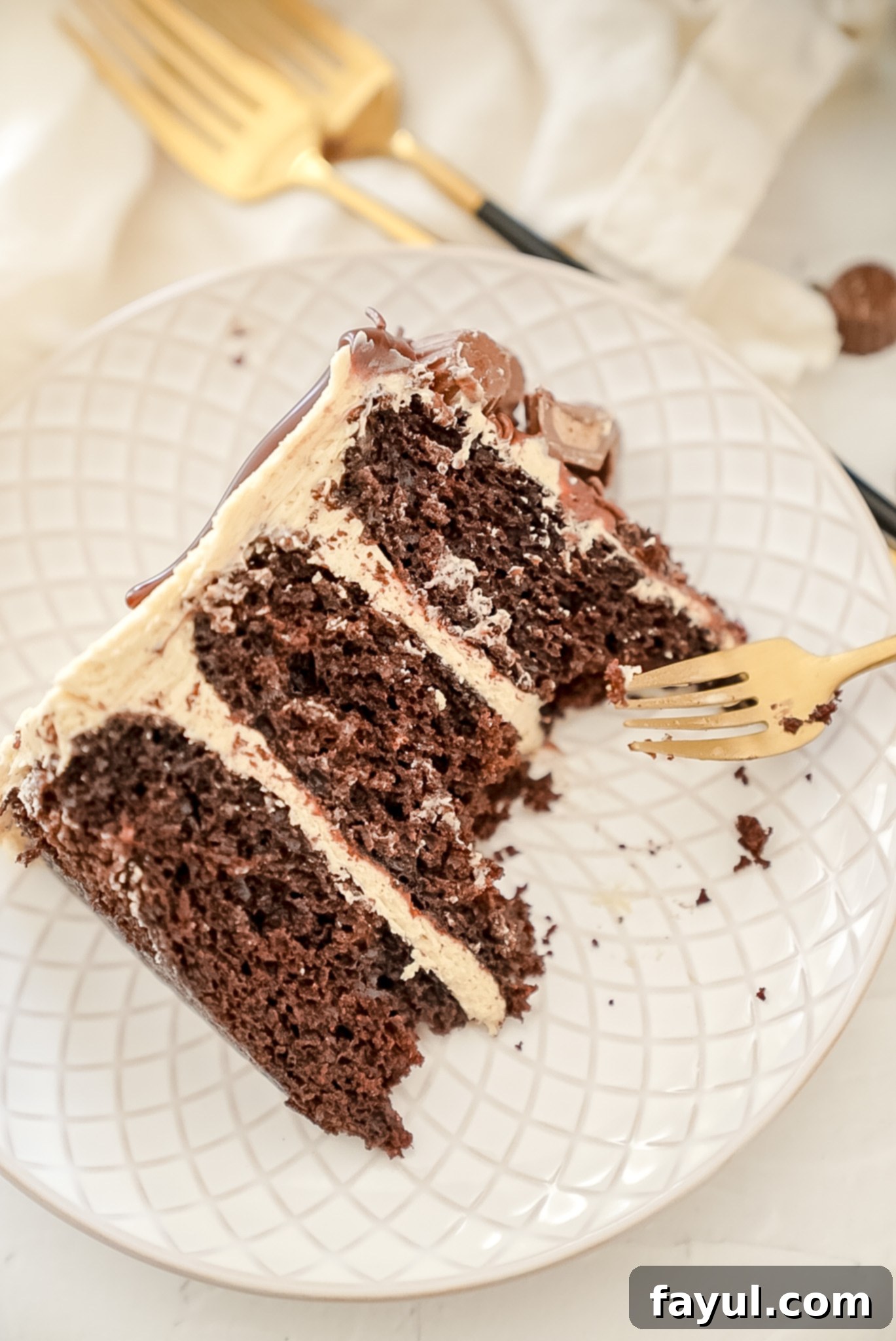 Chocolate cake batter being mixed in a stand mixer