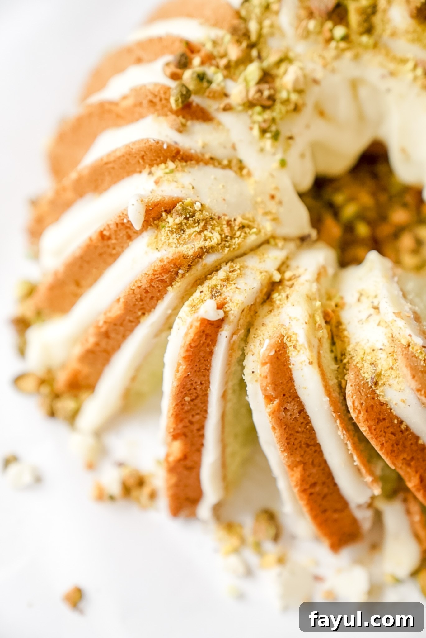 Two bundt cakes cooling on wire racks, showing their intricate designs after being removed from the pan.