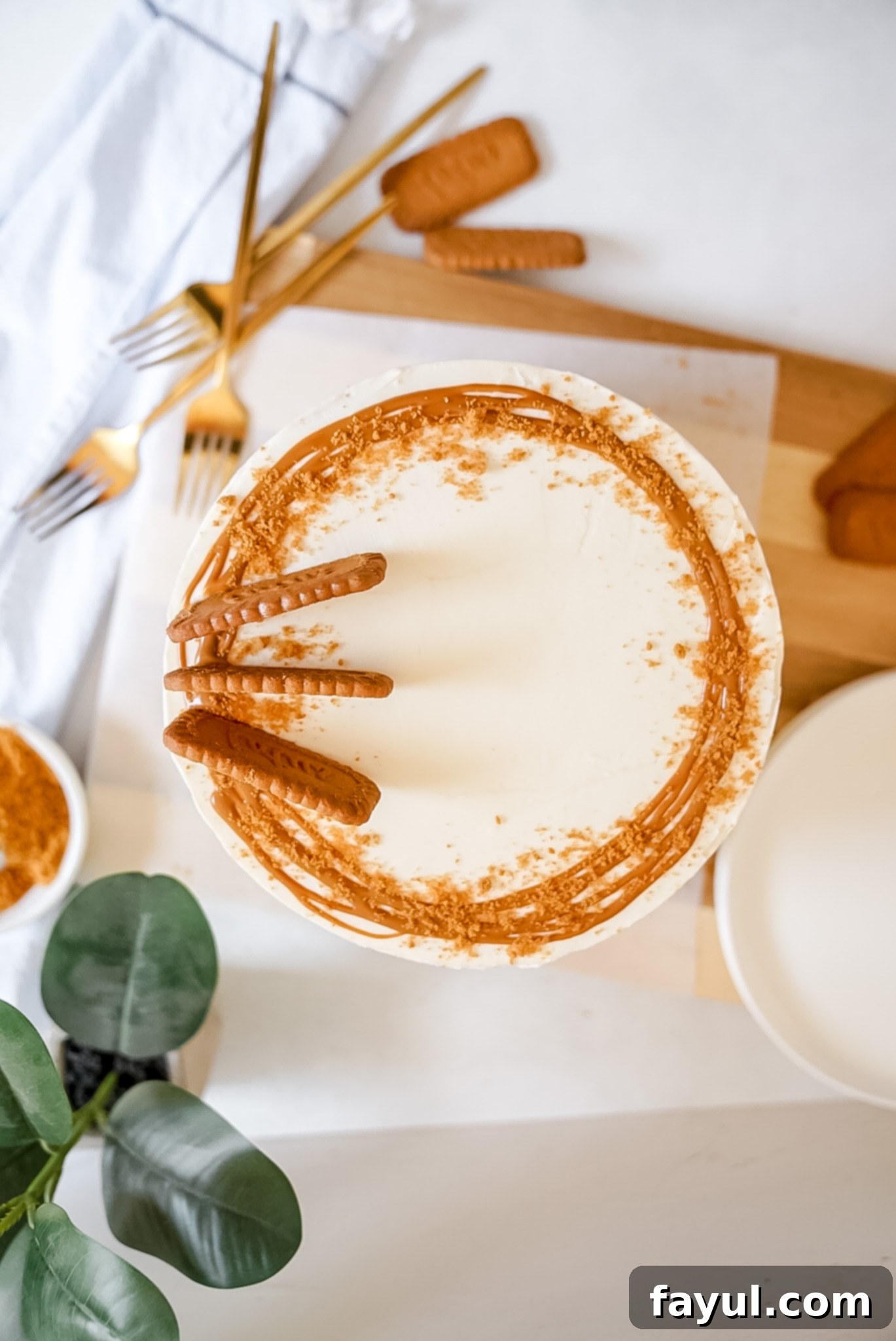 Two views of the Ultimate Biscoff Cake, showing its layers and elegant frosting