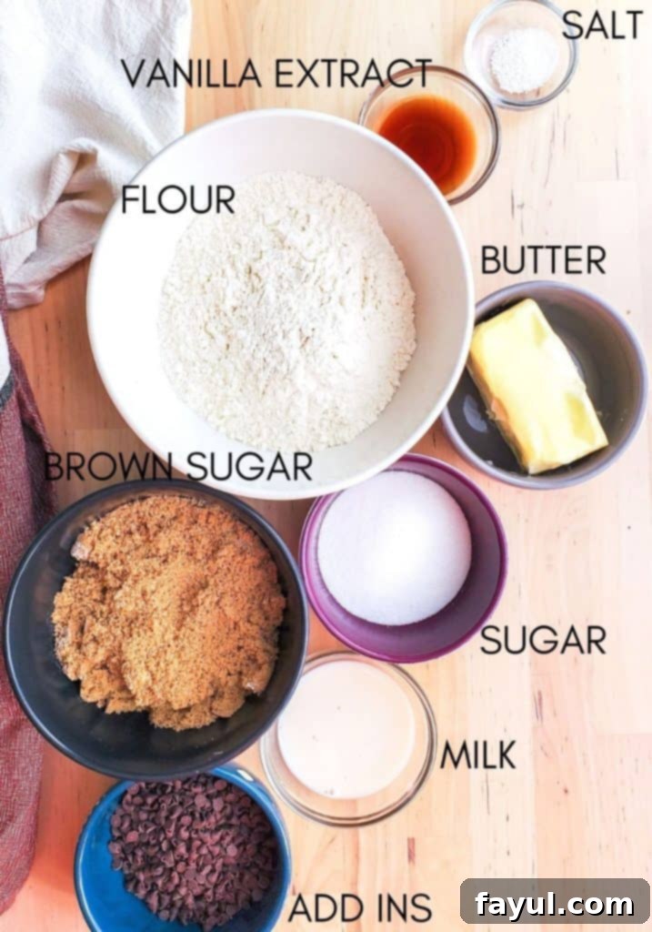 Overhead shot of edible cookie dough ingredients in small bowls with names in black text, ready to be combined.