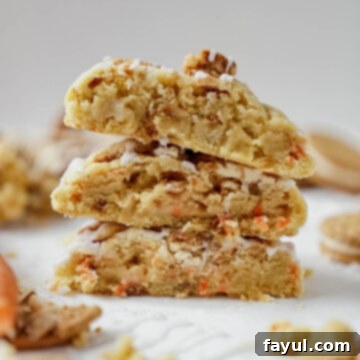 A freshly baked Carrot Cake Oreo Cookie with cream cheese drizzle.