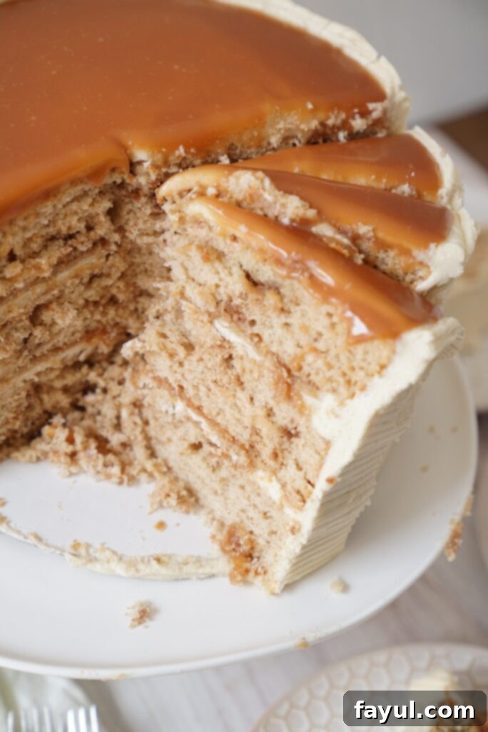 Cake batter being mixed in a stand mixer, with dry ingredients and buttermilk nearby