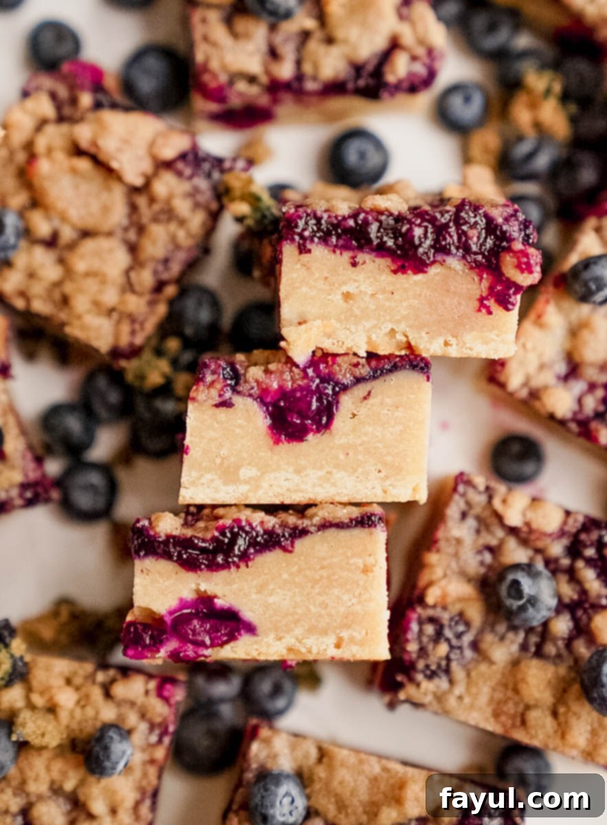 Fresh blueberries and baking ingredients laid out for making blondies.