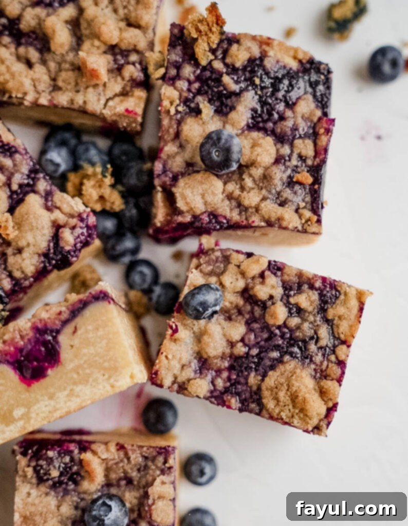 Close-up of a single Blueberry Crisp Blondie slice.