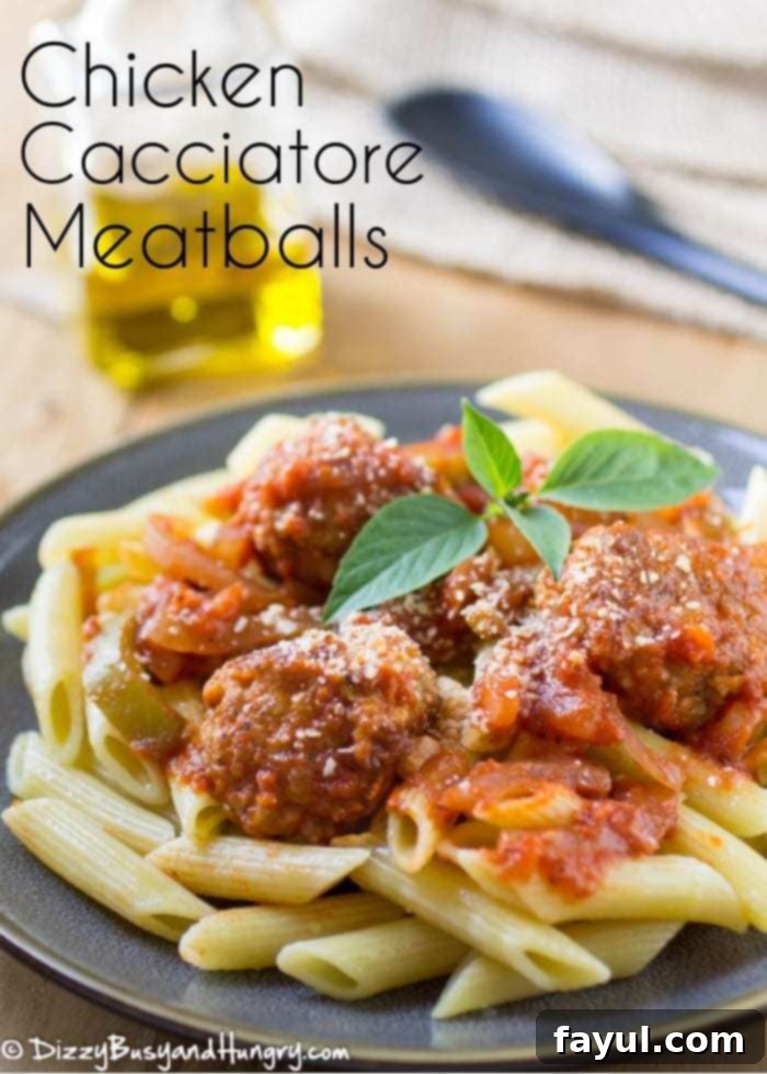 Close-up shot of delectable chicken cacciatore meatballs served on a black plate, with an olive oil jar and a black spoon blurred in the background.