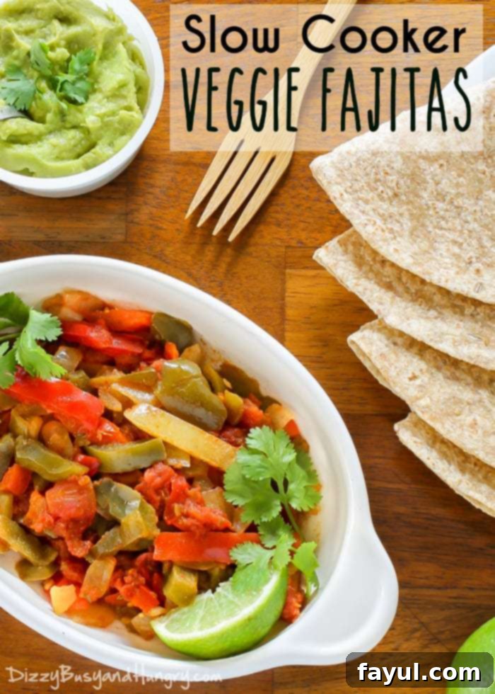 Overhead view of a vibrant slow cooker veggie fajita mix, served in a white bowl with warm tortillas and a side of creamy guacamole.