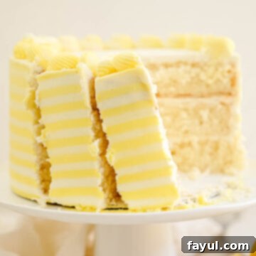 Delicious three-layer light lemon cake with cream cheese frosting and yellow stripes.