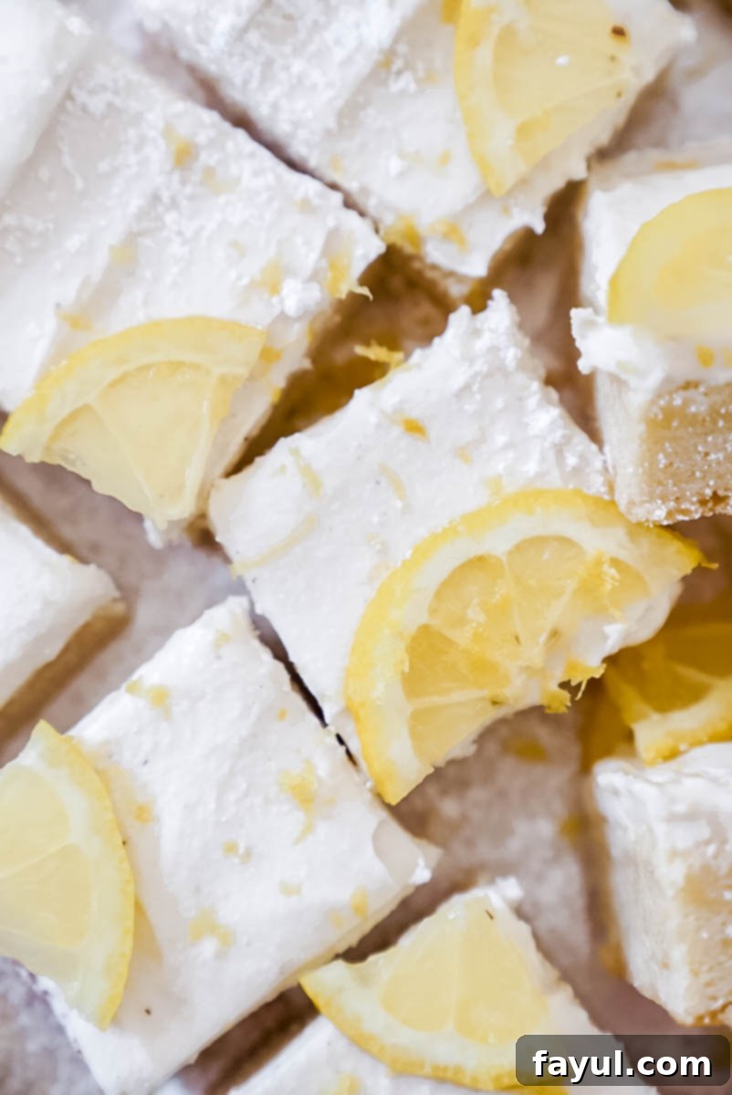 Lemon cookie bars with a generous layer of cream cheese frosting
