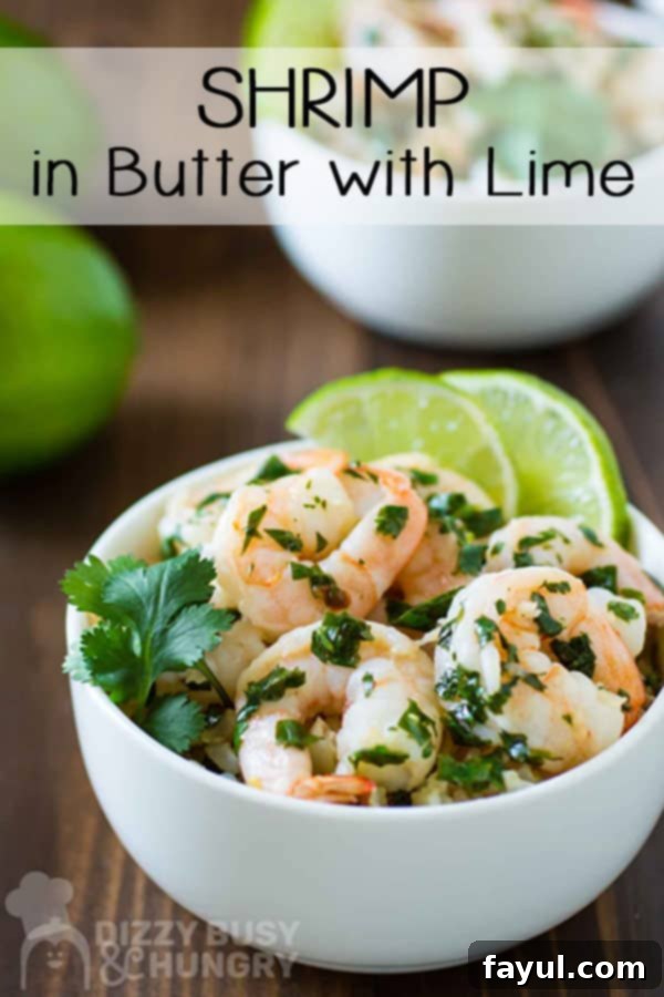 Easy seafood recipe: shrimp tossed with butter and cilantro in a white bowl with slices of lime for garnish