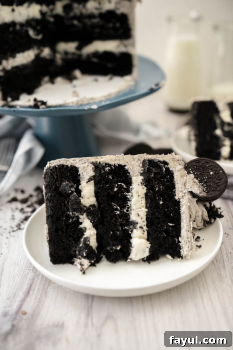 Another close-up of the Cookies and Cream Cake, showing the intricate details of the piped buttercream and scattered Oreo pieces on top.