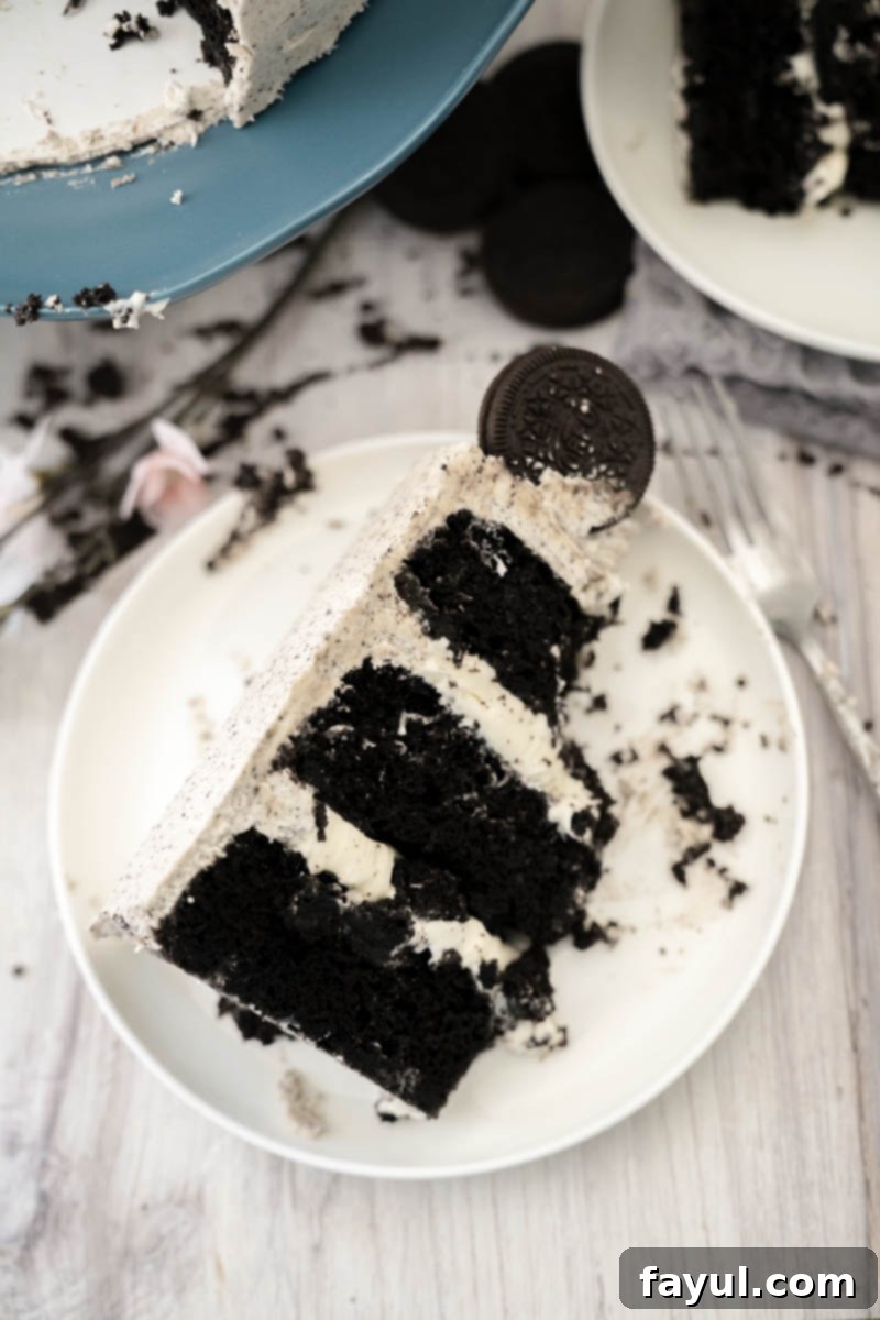 A top-down view of the assembled cake showing the layered chocolate cake, cream cheese filling, and rich Oreo buttercream.