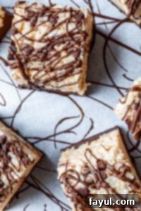 Overhead view of several Nutella Rice Krispie Treats on white parchment paper