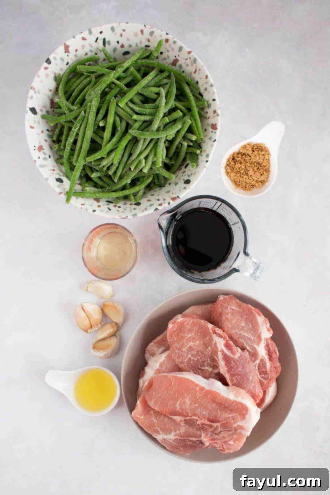 Overhead image of ingredients required to make braised pork and vegetables.