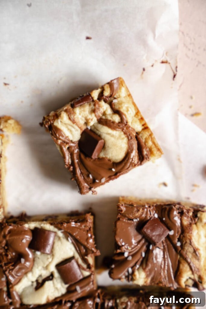 Delicious Nutella Blondies with a perfect swirl, ready to be enjoyed.