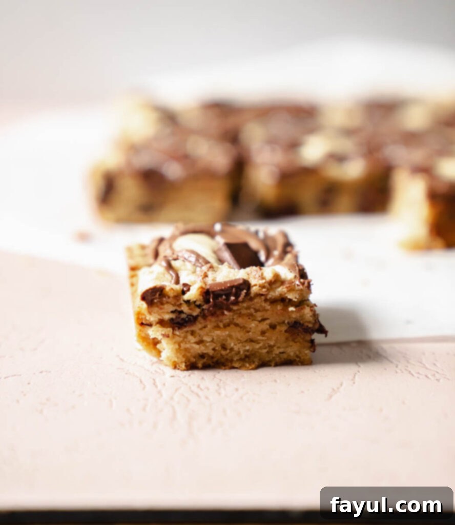 Freshly baked Nutella blondies cooling on a wire rack.