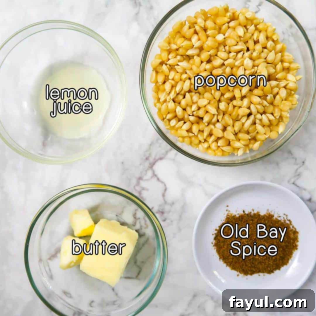 Overhead view of ingredients- popcorn, lemon juice, butter, and old bay spice.