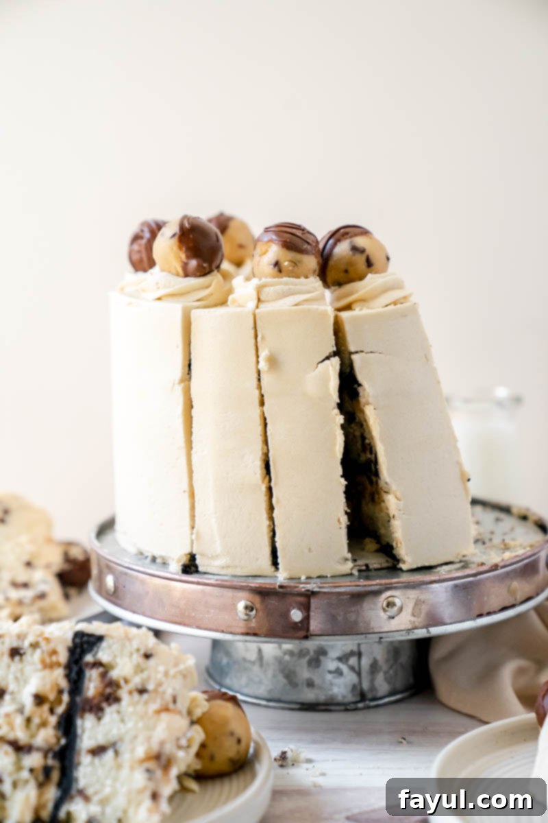 Close-up of the edible cookie dough filling between cake layers.