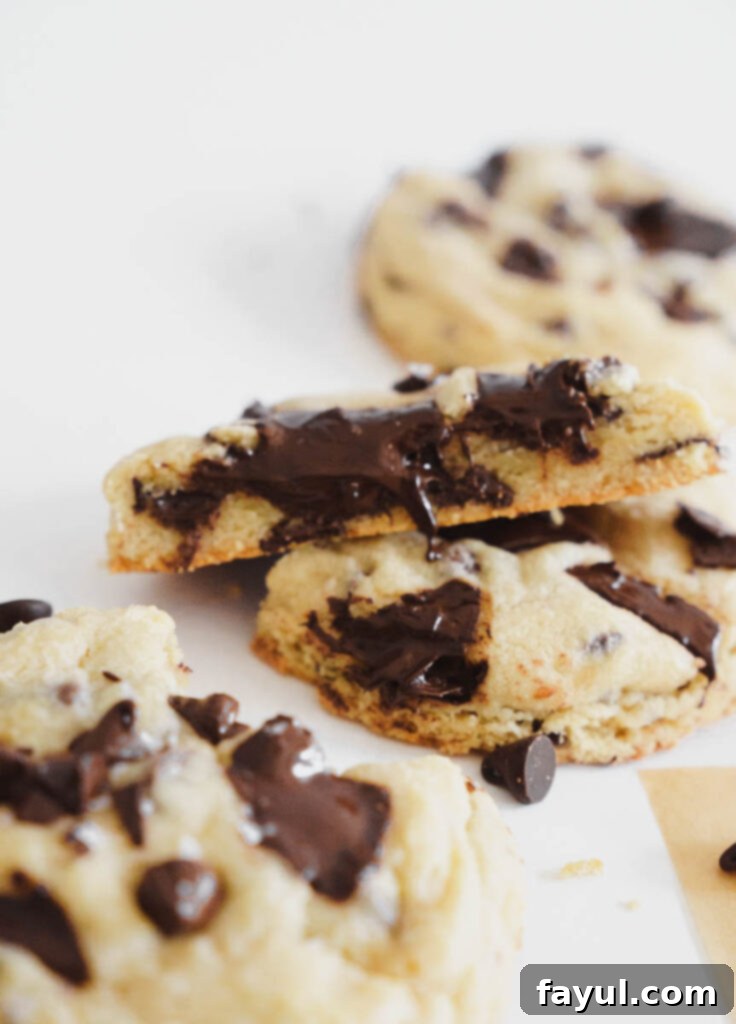 Freshly baked chocolate chip cookies cooling on a wire rack