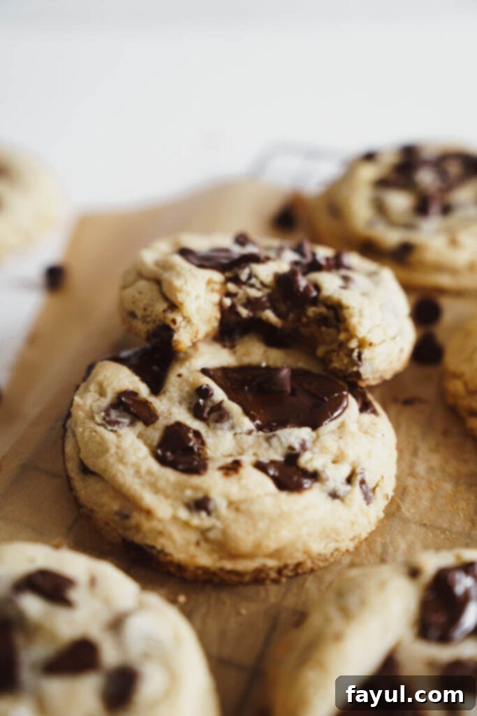 A plate of warm, soft chocolate chip cookies, ready to be enjoyed