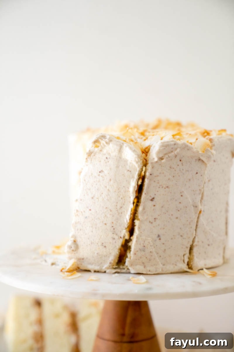 Two Coconut Caramel Pecan Cake slices side-by-side, showcasing the distinct layers and rich frosting.